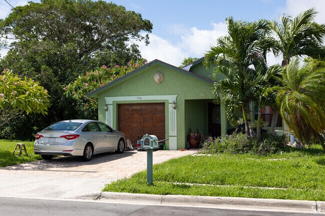 Colorful ranch-style home in Riviera Beach neighborhood.