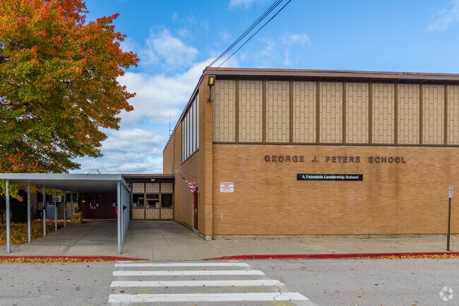 George J. Peters School sits on Cranston’s west end near a cluster of local businesses.