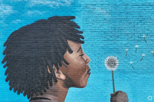 A vibrant blue mural on Warren Avenue in the Warren Avenue Community.