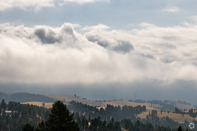Misty clouds drift over the rolling hills near Jefferson City.