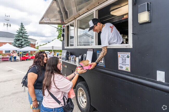 There are many smiles at the Brookfield Farmers Market in Brookfield.