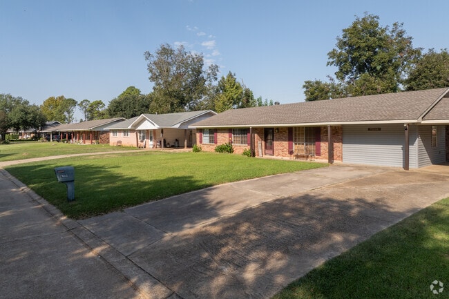 Many homes feature brick exteriors, blending seamlessly with the neighborhood's surroundings.