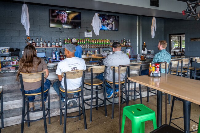 Patrons sit at Brew Link Pub's bar in Downtown Plainfield, where the beer is made in house.