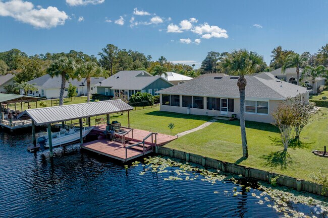 Drive or boat home to one of the many properties with water access in Pierson, Florida.