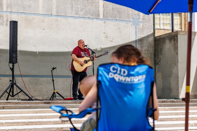 Residents young and old enjoy local talent on stage at Concerts in the Park in Downtown.