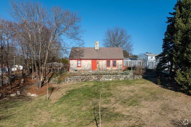 A historical Cape Cod style home rests quietly on a hilltop in Thompson Hill.