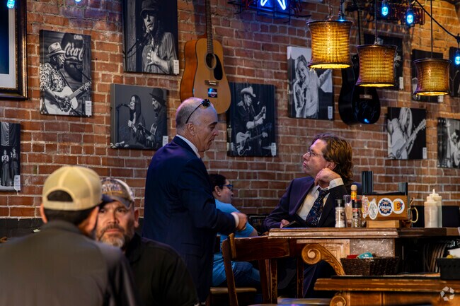 Patrons at Red Brick Tavern chat during their lunch break in Conroe.