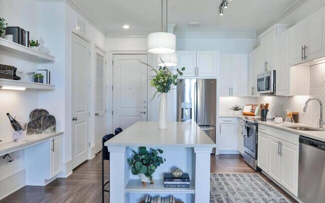 Apartment Kitchen with Island Storage, Shelves, and Stainless Steel Appliances