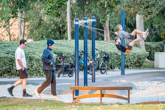 Hilltop Park in Ladera Ranch has pathways for walks and swings at the playground.