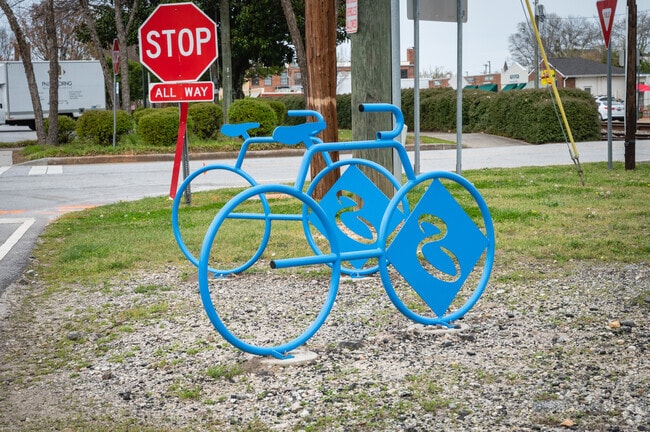 Blue metal bicycle sculptures stand in downtown Simpsonville.