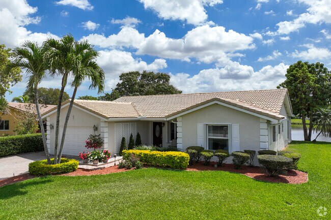 Modern traditional home in Tamarac where you can find spacious front yards.