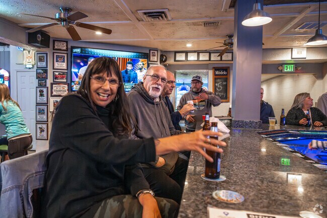 Grab a drink with a friend at The Office Bar and Grille in Riviera Beach .