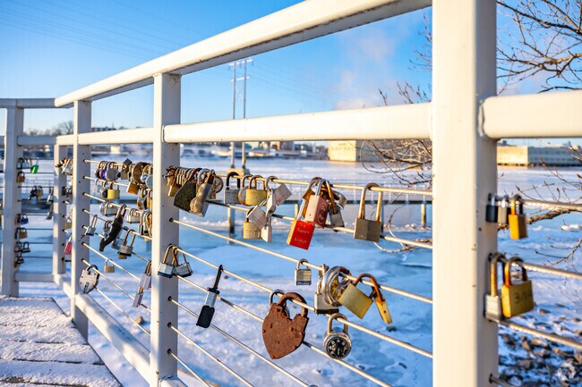 Couples will attach a lock to the De Pere Riverwalk pier.