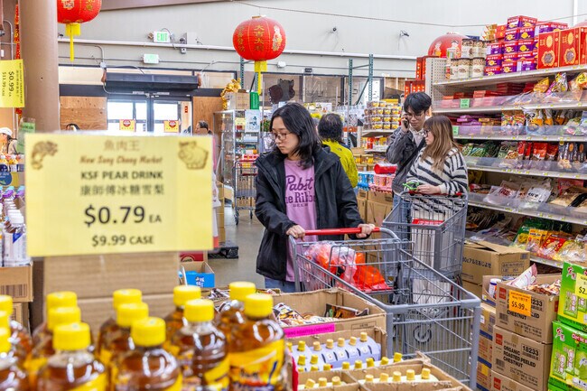 Locals shop for groceries at New Sang Chong Market, the neighborhood Chinese grocery store.