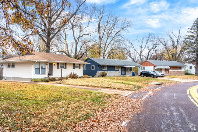 Many homes are built along curving streets in the Glasgow Village neighborhood.