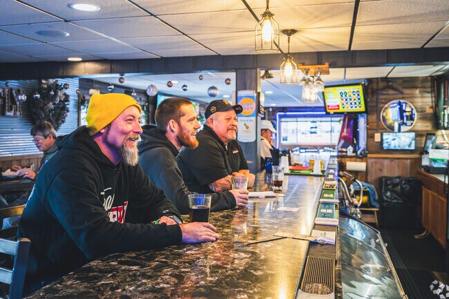 North End residents gather for happy hour at The Mayfly.