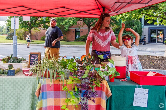 Some children are very enthusiastic about selling lemonade at the DeWitt Farmer's Market.