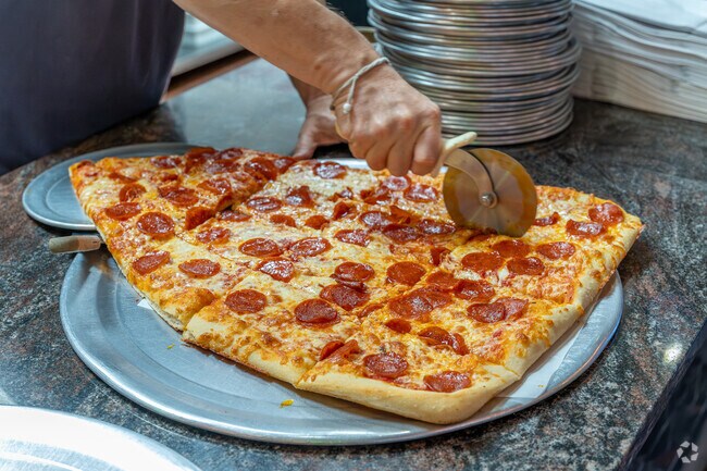 Pizza Barn on Central Park Avenue in Lincoln Park is known for its two-foot super slice.