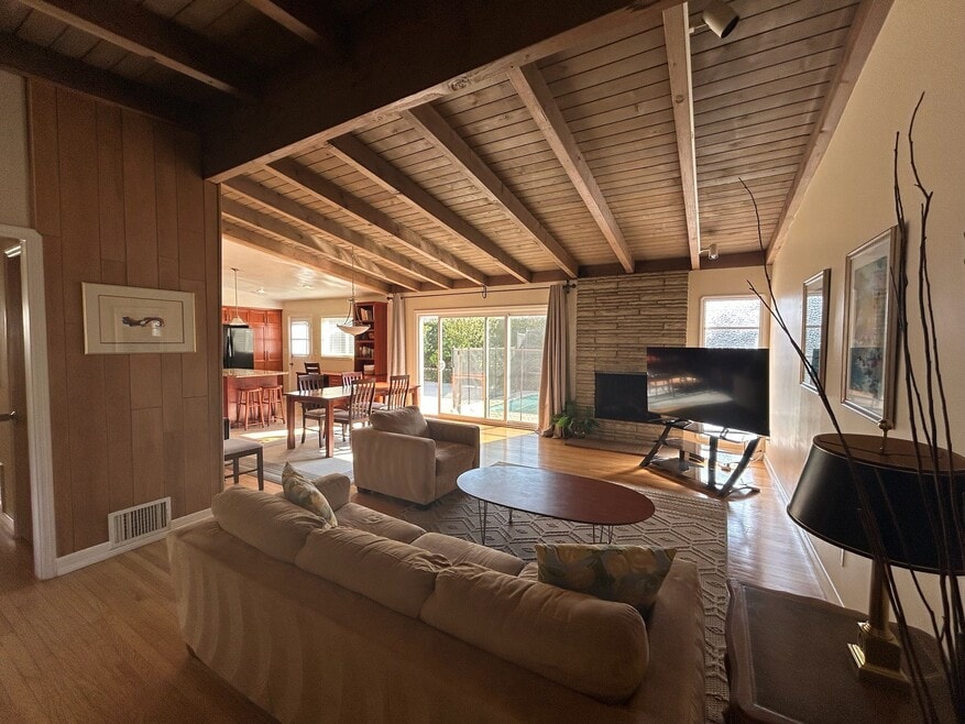 Living Room - Open Floor Plan to Dining Room, Kitchen, and backyard