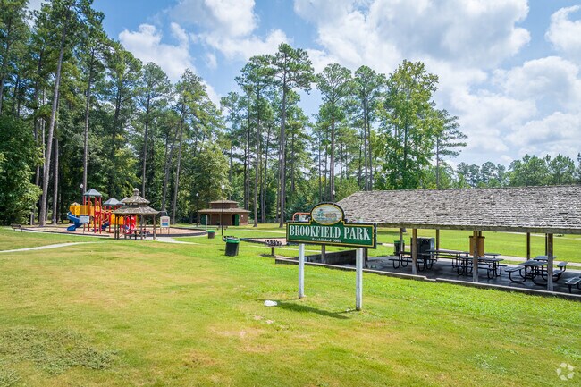 Residents enjoy time outdoors and in the sun at Brookfield Park in Westside.