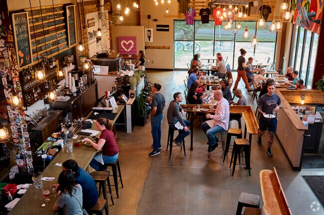Customers enjoy the fun atmosphere at the Caboose Brewing Company in Vienna.