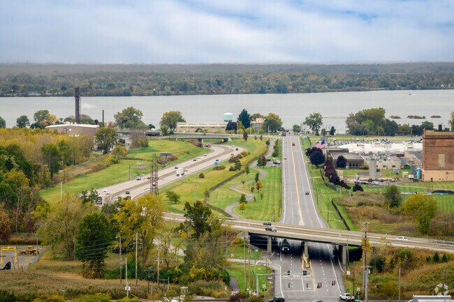 The homes in Riverview are separated from the river by some industrial sites.