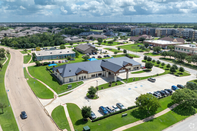 Explore Kiddie Academy of Bryan's layout with an aerial view of the campus.