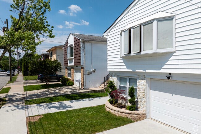 Bay Terrace features modest single-family and semi-attached homes with small yards.