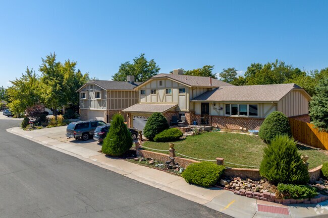 Split-level ranchers in The Farm neighborhood have well manicured front lawns.