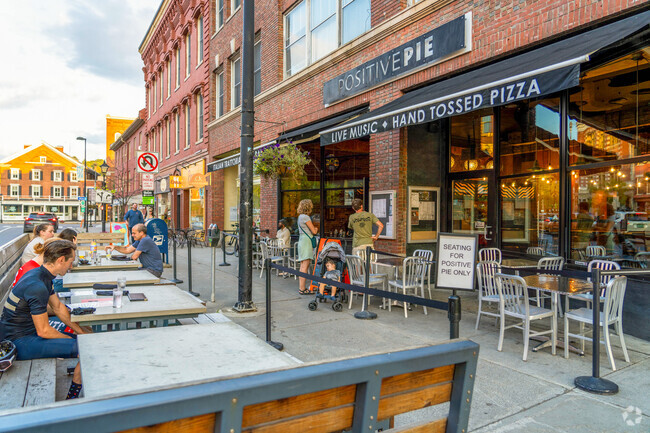 Folks dine outside on the patio at Positive Pie in Downtown Montpelier near Park West.