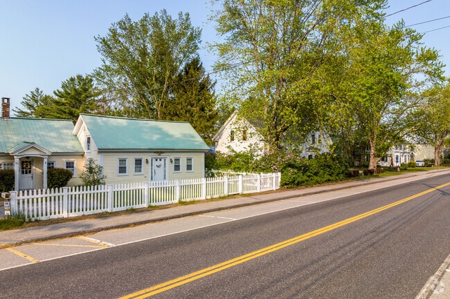 A row of homes line Roosevelt Trail in Naples, Maine.
