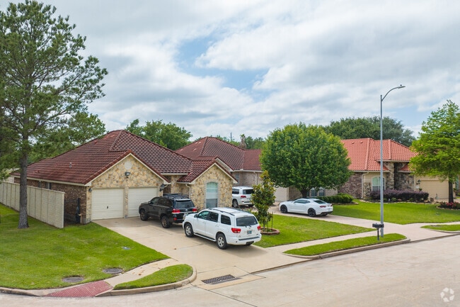 Lakes of Jersey Village features single‑ and two‑story homes in varied styles.