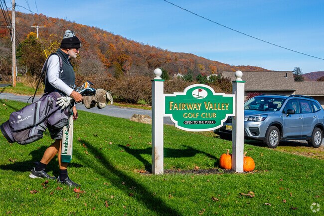 A golfer is arriving to spend some time on the links in Washington, NJ.