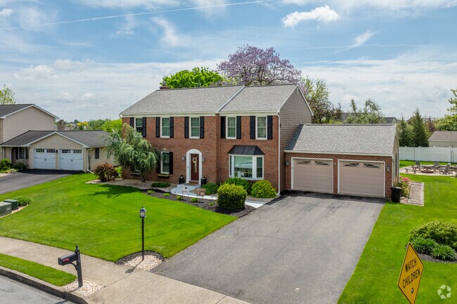 Brick colonial homes have luxurious interiors and size-able green space in Northampton.