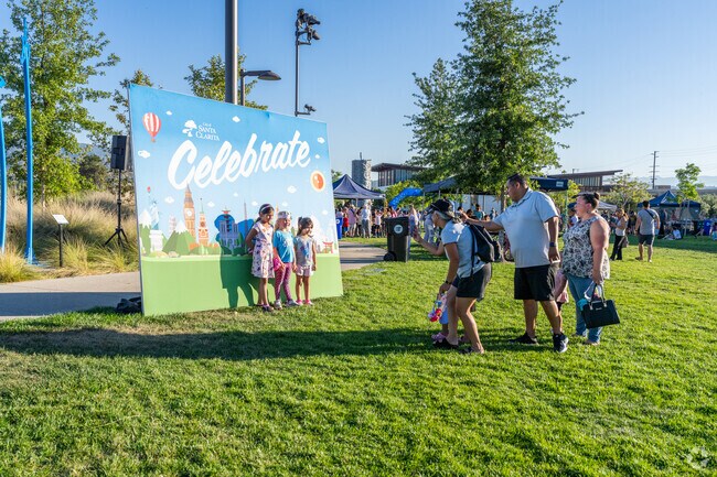 Kids have their photo taken in front of the Celebrate sign in Canyon Country.