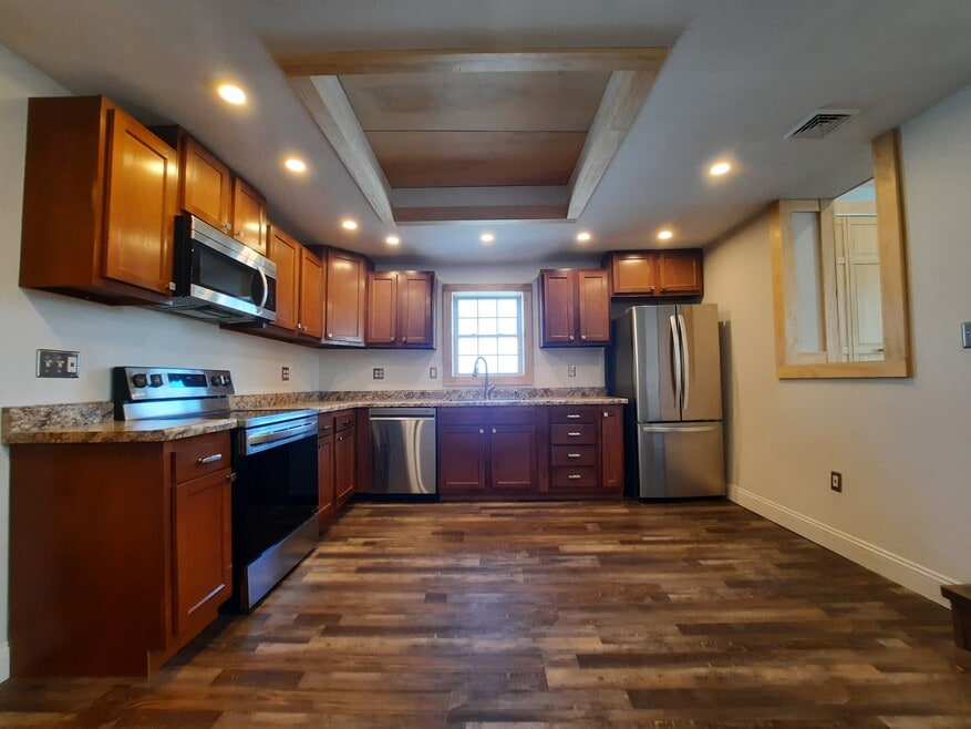 custom kitchen with all stainless steel appliances