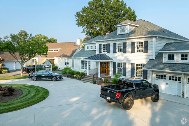 Large water front homes sit the shade of mature trees in the lovely Newtown/Crown Point area.