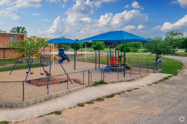 Covered playground equipment at Olmos Elementary School keeps kids out of the sun.