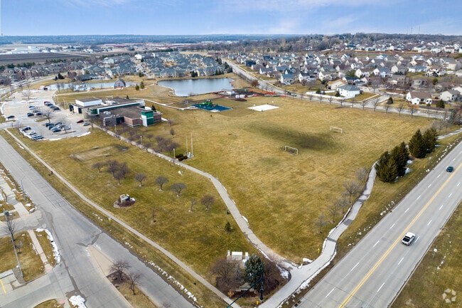 The Johnston Commons features a massive park, pond, playground, walking trails, historical museum, and the Johnston Public Library
