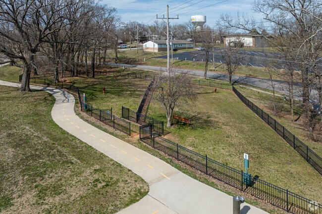 Furry friends in Gravette roam free in the dog park at Old Town Park.