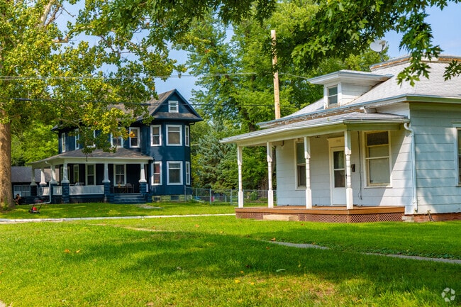 Victorian-style homes and Craftsman bungalows line College Hill neighborhood.