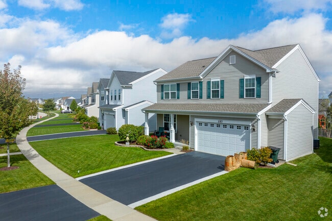 New Traditional homes sit on well manicured lawns and peaceful streets in Mundelein.