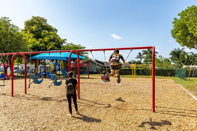 A family plays in the sun at Pine Island Park in Rainbow Lakes.