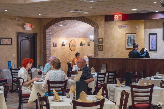 Enjoy Italian cuisine in the dimly lit dining room at Villa Fazzolari Ristorante in Newtonville.