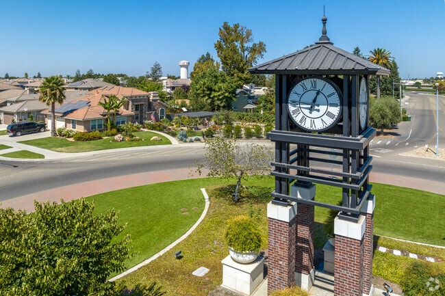 A clock tower stands at a roundabout in central Ripon.