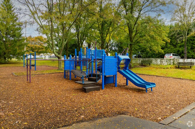 Hilltop Park features a tot-lot and a paved loop, popular with casual walkers.