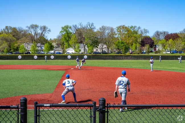 The Whitefish Bay high school team warming up before a game at Cahill Park.