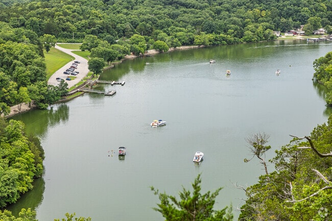 Boaters enjoy a calm cove on Lake of the Ozarks in Roach.
