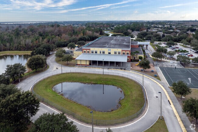 Moss Park Elementary School's bus loop is situated on the west side.