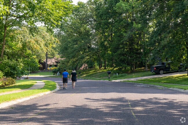 The shady streets of Green Meadows give residents a great place for a morning stroll.